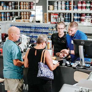 Sales Associates making sales in a paint store